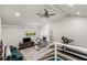 Upstairs space with seating, desk, and treadmill, illuminated by natural light through a large window at 3306 Briarcliff Ne Rd, Atlanta, GA 30345