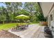 Outdoor patio area with table, chairs, umbrella, and manicured backyard, great for outdoor entertainment at 3306 Briarcliff Ne Rd, Atlanta, GA 30345