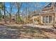 Landscaped backyard featuring lawn and patio area for outdoor enjoyment at 4990 Sawgrass Nw Pl, Acworth, GA 30102