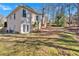 Lawn and landscaping in backyard adjacent to the home's patio and doors at 4990 Sawgrass Nw Pl, Acworth, GA 30102