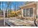 Backyard features an open patio area with a sunshade, adjacent to the house at 4990 Sawgrass Nw Pl, Acworth, GA 30102