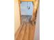 Finished basement hallway with new flooring and exposed utilities at 4990 Sawgrass Nw Pl, Acworth, GA 30102