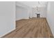 Spacious basement features wood floors, a chandelier, and an attached kitchen area at 4990 Sawgrass Nw Pl, Acworth, GA 30102