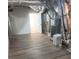 Spacious basement with new flooring, exposed ductwork, and utility systems at 4990 Sawgrass Nw Pl, Acworth, GA 30102