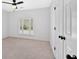Bedroom with neutral carpet and a modern ceiling fan offering a serene and comfortable atmosphere at 4990 Sawgrass Nw Pl, Acworth, GA 30102