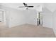 Spacious carpeted bedroom with a modern ceiling fan and bright, natural light at 4990 Sawgrass Nw Pl, Acworth, GA 30102
