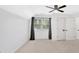 Bedroom featuring carpeting, a ceiling fan, and a window with light-blocking curtains at 4990 Sawgrass Nw Pl, Acworth, GA 30102