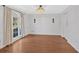 Bright dining room featuring hardwood floors and a large window with natural light at 4990 Sawgrass Nw Pl, Acworth, GA 30102