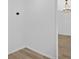 Bright empty room features wood floors and a stylish light fixture at 4990 Sawgrass Nw Pl, Acworth, GA 30102