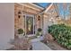 Elegant front door featuring stone accents, decorative wreath, and well-maintained landscaping at 4990 Sawgrass Nw Pl, Acworth, GA 30102