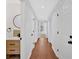 Hallway with wood floors featuring a sink and white doors at 4990 Sawgrass Nw Pl, Acworth, GA 30102