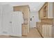 Kitchen featuring countertops, white cabinets, stainless steel appliances, and tile flooring at 4990 Sawgrass Nw Pl, Acworth, GA 30102