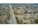 A neighborhood view from above, showing homes along a greenway and busy main road at 5006 Merton Ln, Marietta, GA 30068