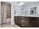 Bathroom featuring double vanity, modern fixtures, and walk-in shower with neutral tile at 5006 Merton Ln, Marietta, GA 30068