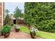 Beautiful brick patio and lush landscaping create a serene backyard retreat at 8025 Georgetown Cir, Suwanee, GA 30024