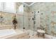 Primary bath featuring a walk-in shower, patterned wallpaper, and tile flooring at 8025 Georgetown Cir, Suwanee, GA 30024