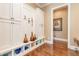 Hallway with custom cabinets, seating, and decorative storage cubbies at 8025 Georgetown Cir, Suwanee, GA 30024