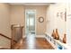 Charming hallway with hardwood floors and built-in storage cabinets and bench at 8025 Georgetown Cir, Suwanee, GA 30024