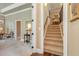 Hallway with staircase, hardwood floors and neutral paint at 8025 Georgetown Cir, Suwanee, GA 30024