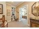 Cozy hallway nook with built-in shelving, leading to the bedroom through French doors at 8025 Georgetown Cir, Suwanee, GA 30024
