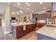 Spacious kitchen with granite countertops, island, modern appliances, and recessed lighting at 8025 Georgetown Cir, Suwanee, GA 30024