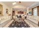 Open concept living room and kitchen featuring hardwood floors and vaulted ceilings at 8025 Georgetown Cir, Suwanee, GA 30024