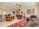 Living room area with leather seating, a desk, and a decorative rug at 8025 Georgetown Cir, Suwanee, GA 30024