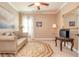 A comfy living room with a couch, large rug, and a TV at 8025 Georgetown Cir, Suwanee, GA 30024