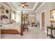 Spacious main bedroom featuring tray ceilings, and ample natural light at 8025 Georgetown Cir, Suwanee, GA 30024