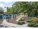 Community playground featuring slides, climbing structures, and a wood chip ground cover at 8025 Georgetown Cir, Suwanee, GA 30024