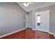 Bedroom with hardwood floors, vaulted ceiling, fan and multiple closets at 5362 Hickory Nw Knl, Norcross, GA 30071