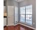 Bright breakfast nook features a large window and a door leading to a mudroom or garage at 5362 Hickory Nw Knl, Norcross, GA 30071