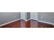Hallway with hardwood floors, white trim and multiple closets at 5362 Hickory Nw Knl, Norcross, GA 30071
