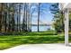 A beautiful, well-maintained back yard with direct access and views of the lake at 6475 Holland Dr, Cumming, GA 30041