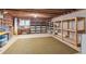 Large basement space with shelving and storage, ready for customization at 6475 Holland Dr, Cumming, GA 30041