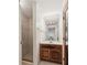 Compact bathroom featuring a glass shower and wood vanity at 6475 Holland Dr, Cumming, GA 30041