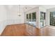 Dining room with coffered ceiling, chandelier, and sliding door access to outdoor deck at 6475 Holland Dr, Cumming, GA 30041