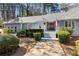 Charming single-story home with manicured landscaping, stone walkway, and a welcoming front entrance at 6475 Holland Dr, Cumming, GA 30041