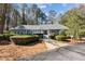 Charming single-story home with manicured landscaping, stone walkway, and a welcoming front entrance at 6475 Holland Dr, Cumming, GA 30041