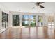 Bright living room with hardwood floors and lake views from the large windows at 6475 Holland Dr, Cumming, GA 30041