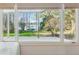 Lake house window view showing the lake, private boat dock, and lush green lawn at 6475 Holland Dr, Cumming, GA 30041
