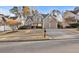 Inviting two-story home featuring stone accents, manicured lawn, and a two-car garage at 86 Templeton Ln, Villa Rica, GA 30180