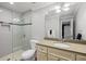 Beautifully tiled bathroom featuring glass enclosed shower and a modern vanity at 2413 Drew Valley Rd, Brookhaven, GA 30319