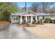 Charming exterior view of a house with a well-maintained yard and driveway at 2413 Drew Valley Rd, Brookhaven, GA 30319