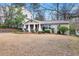 Well-maintained front yard with established landscaping complements the home's exterior at 2413 Drew Valley Rd, Brookhaven, GA 30319