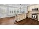 Bright kitchen featuring an island with granite countertop, hardwood floors, and stainless steel appliances at 2413 Drew Valley Rd, Brookhaven, GA 30319