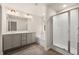 Modern bathroom with double vanity and glass enclosed shower at 1084 Georgian Point Dr, Lawrenceville, GA 30045