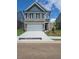 Charming two-story home with a spacious two-car garage and well-manicured lawn at 1084 Georgian Point Dr, Lawrenceville, GA 30045