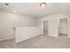 Carpeted hallway with white walls provides seamless transition and flow between spaces at 1084 Georgian Point Dr, Lawrenceville, GA 30045