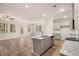 Open-concept kitchen featuring granite countertops, stainless steel appliances, and a spacious island at 1084 Georgian Point Dr, Lawrenceville, GA 30045